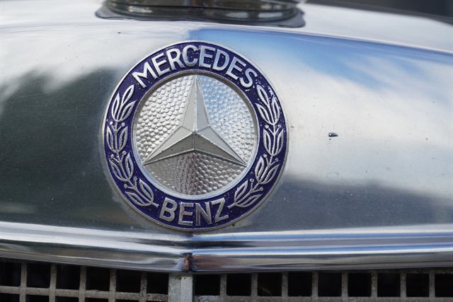 Polished Mercedes-Benz bonnet badge above a cleaned chrome grille.